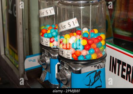 Sydney Australia - January 25 2011; Editorial-Two gumball machines with colourful sweets on street in city Stock Photo