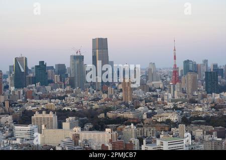 Tokyo, Japan. 9th Feb, 2023. The skyline urban cityscape at sunset viewed from Ebisu looking towards modern high rise development in Roppongi and Minato City, home to the Roppongi Hills development and Tokyo Tower.The population of Tokyo is about 13.9 million people while the metropolitan area is about 40 million people, making it the most populous city in the world. The population of Tokyo is expected to continue to grow in the coming years, as more people move to the city in search of jobs and opportunities despite Japan's declining birthrate. The government of Japan fearing housing sho Stock Photo