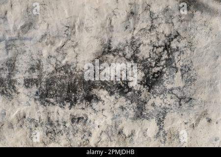 Detail of damp stain on a lime washed wall. grunge texture Stock Photo