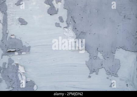 Detail of worn out plaster coating on a closed store window, grunge texture, abstract background Stock Photo