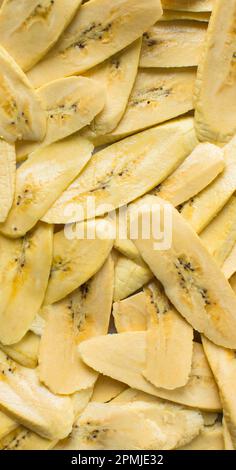 Top view of slices of ripe plantains , slices of yellow plantains for frying, process for making fried plantain Stock Photo