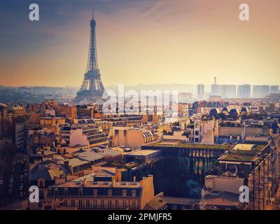 Smog over Paris city, France. Foggy sunset view to the Eiffel Tower due high level of pollution caused by busy urban traffic Stock Photo