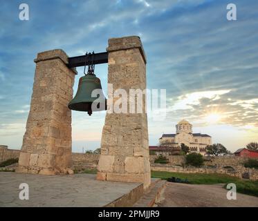 Evening the bell of Chersonesos (ancient town) and St Vladimir's Cathedral (Sevastopol, Crimea, Ukraine) Stock Photo