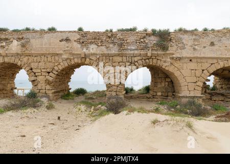 Ancient Roman aqueduct in Caesarea, Israel Stock Photo