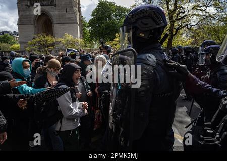 Paris, France. 13th Apr, 2023. Protesters confront French gendarmes and CRS riot police during a demonstration against a pensions reform plan in Paris, France, on April 13, 2023. Around 380,000 people participated in the 12th nationwide general mobilization organized by the unions against the government's pension reform plan, the French Interior Ministry said on Thursday. Credit: Aurelien Morissard/Xinhua/Alamy Live News Stock Photo