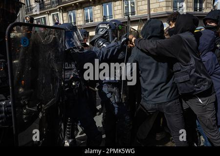 Paris, France. 13th Apr, 2023. Protesters confront French gendarmes and CRS riot police during a demonstration against a pensions reform plan in Paris, France, on April 13, 2023. Around 380,000 people participated in the 12th nationwide general mobilization organized by the unions against the government's pension reform plan, the French Interior Ministry said on Thursday. Credit: Aurelien Morissard/Xinhua/Alamy Live News Stock Photo