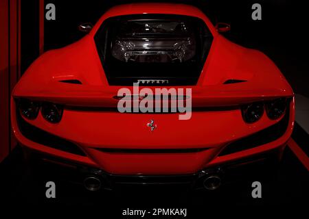 Maranello, Italy - April 01, 2023: Rear view of a red Ferrari with an engine in the trunk. Stock Photo