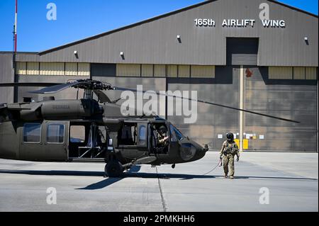 A crew of a UH-60 Blackhawk helicopter assigned to the Georgia Army National Guard conducts a pre-flight checklist prior to departing the 165th Airlift Wing(AW) on Apr. 11, 2023 located at the Savannah Air National Guard Base, Georgia. The crew of three, which consists of two pilots and one crew chief, was responsible for flying the Adjutant General of the Georgia Air National Guard, U.S. Air Force Maj. Gen. Konata A. Crumbly,  to the 165 AW for a congressional staff meeting and base tour. (U.S. Air National Guard photo by Master Sgt. Caila Arahood) Stock Photo