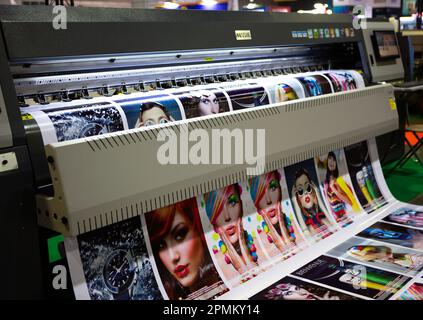 Bangkok, Thailand - March 31, 2023: Wide format digital ink jet printer display in Print Tech 2023. Stock Photo