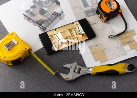 website wireframe sketch and programming code on smartphone Stock Photo