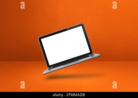 Blank computer laptop floating over an orange background. 3D isolated illustration. Horizontal template Stock Photo