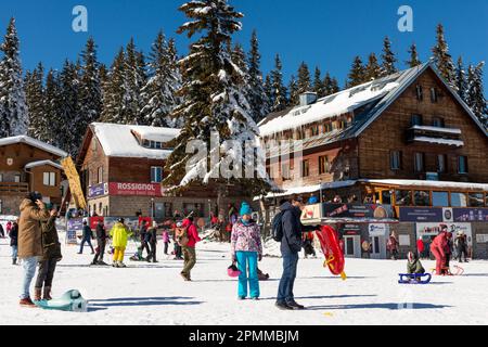 People, visitors and skiers, enjoying the sunny Winter day at Aleko Hut in Vitosha Mountain above Sofia, Bulgaria, Eastern Europe, Balkans, EU Stock Photo