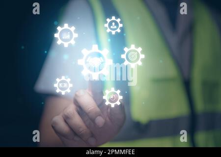 worker with work planning. partner and cooperation icon showing on screen. Stock Photo