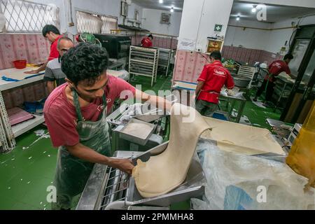 A worker produces cane bread at a Middle Eastern frozen food home industry, Ka Nung Bogor, Bogor City, Indonesia, April 6, 2023. Stock Photo