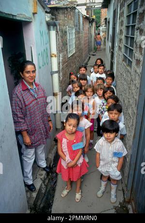 Argentina, Buenos Aires. Teacher and schoolchildren. Stock Photo