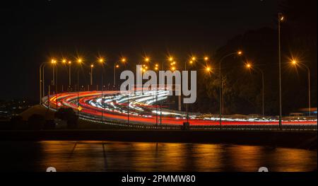 Long exposure image of car light trails on busy motorway. Evening rush hour traffic jam on motorway north of Harbour Bridge. Auckland. Stock Photo