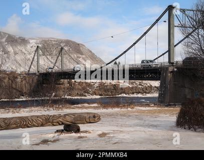 Iceland's iconic Ölfusárbrú bridge a 2-lane, 84m vehicular steel wire suspension bridge over Ölfusá river connecting Ring Road One with Selfoss Town. Stock Photo