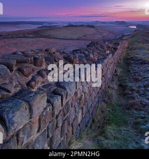 Sunrise in Winter on Winshields Crags on Hadrian's Wall looking East towards Steel Rigg, Northumberland National Park, Northumberland Stock Photo