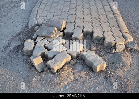 Broken paving stones on a parking lot Stock Photo