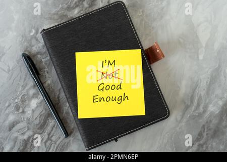 Adhesive paper notes with text  I'm not good enough with the text not crossed off Stock Photo