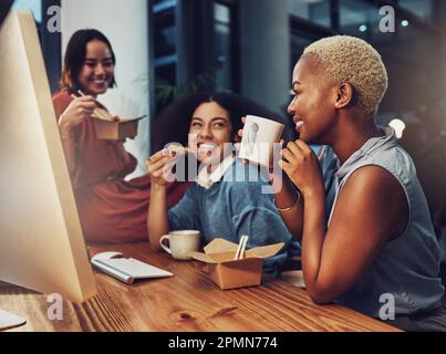 Business team, food and office at night while eating and drinking coffee together at a desk. Diversity women group talking and laughing on late break Stock Photo