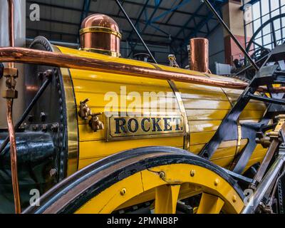 General image inside the National Railway Museum in York seen here featuring a replica of Robert Stephenson's Rocket locomotive Stock Photo