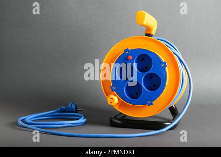 Extension electric cable reel in room Stock Photo