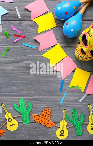 Frame made of Mexican symbols with flags on dark wooden background Stock Photo