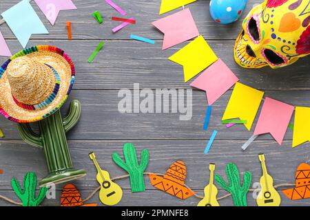 Frame made of Mexican symbols with flags on dark wooden background Stock Photo