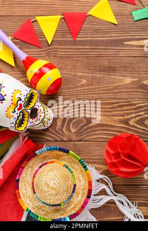 Frame made of Mexican symbols and flags on wooden background Stock Photo