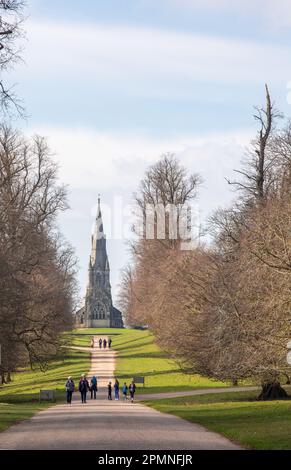 People walking in the grounds of Studley Royal Gardens with St. Mary's Church, Church Walk, Studley Royal, Ripon, North Yorkshire Stock Photo