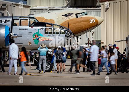 Crowds walk around a B-25 Mitchell bomber and a C-47 Skytrain at the 2023 Thunder and Lightning Over Arizona in Tucson, Arizona. Stock Photo