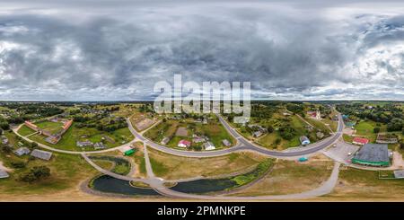 360 degree panoramic view of aerial full seamless spherical hdri 360 panorama view above green village with private development sector with country houses in equirectangular proje