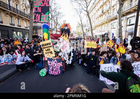 Paris, France. 13th Apr, 2023. Teenagers take part during the rally. New wave of protests on the 12th day of the general strike over the Macron government's new pension reform, before crucial court decision on the legislation of the Constitutional Council. Credit: SOPA Images Limited/Alamy Live News Stock Photo
