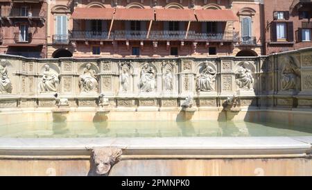 Fonte Gaia is a monumental fountain of Siena, located in Piazza del Campo. It was inaugurated in 1346. Stock Photo