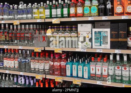 Athens, Greece - March 6, 2023: Gin tequila vodka and rum alcohol drink bottles for sale at liquor store. Stock Photo