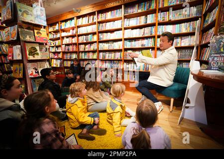 Jamie Oliver answers questions from children at his local independent bookshop, Harts in Saffron Walden, Essex, to promote his new book Billy and the Giant Adventure. Picture date: Friday April 14, 2023. Stock Photo