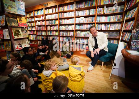 Jamie Oliver answers questions from children at his local independent bookshop, Harts in Saffron Walden, Essex, to promote his new book Billy and the Giant Adventure. Picture date: Friday April 14, 2023. Stock Photo