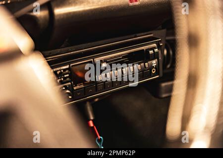 Close-up of a classic car radio with push buttons and tuning dial. Stock Photo
