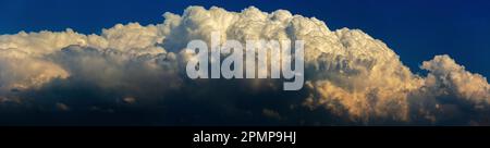 Panorama of dramatic storm clouds and blue sky above; Calgary, Alberta, Canada Stock Photo