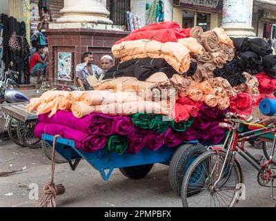 Cart filled with textiles in Dhaka, Bangladesh. The textile industry is by far the most important of the country, and is responsible for most of its e Stock Photo