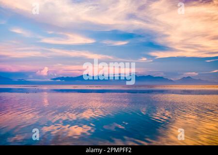 Islands across a shimmering sea; Utila, Honduras Stock Photo