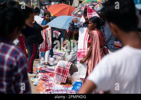 Street vendor selling Assamese traditional Gamosa during Rongali Bihu festival in Guwahati, Assam, India on 14 April 2023. Credit: David Talukdar/Alamy Live News Stock Photo