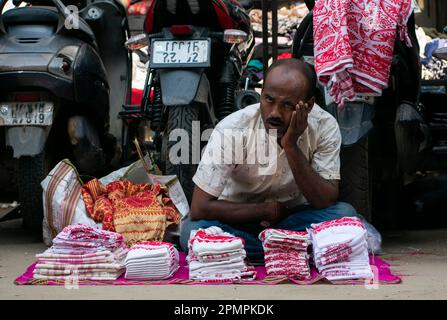 Street vendor selling Assamese traditional Gamosa during Rongali Bihu festival in Guwahati, Assam, India on 14 April 2023. Credit: David Talukdar/Alamy Live News Stock Photo