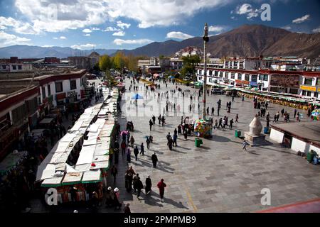 Borkhar market, with Potala Palace in the background; Lhasa, Tibet Stock Photo