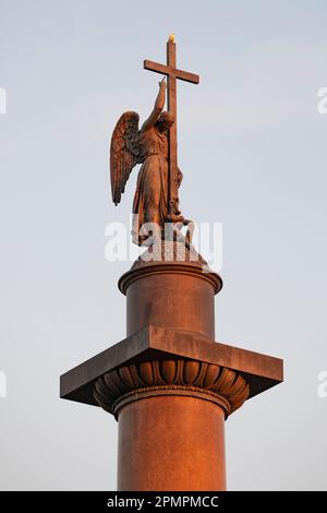 Angel on top of the Alexander Column (1834) in the light of the setting sun. Saint-Petersburg, Russia Stock Photo