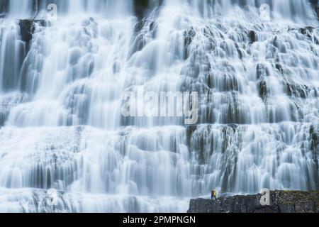 Tourists visit Dynjandi waterfall, also called Fjallfoss, in Westfjords, Iceland; Iceland Stock Photo