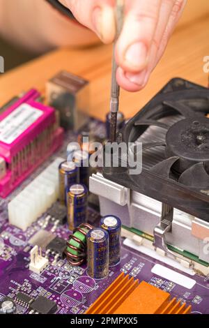 Electric circuit. High technology. Installation of a computer processor radiator fan Stock Photo