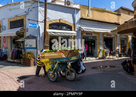Old town of Nicosia. Merchants drive through the alleys with handcarts selling fruits and vegetables in İplik Pazarı Mahallesi, Cyprus Stock Photo