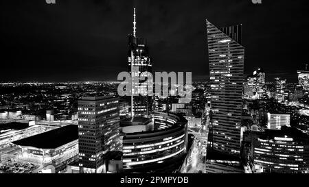 Warsaw, Poland. 14 March 2023. Beautiful architecture of Warsaw city center with modern skyscrapers at night. Black and white. Stock Photo